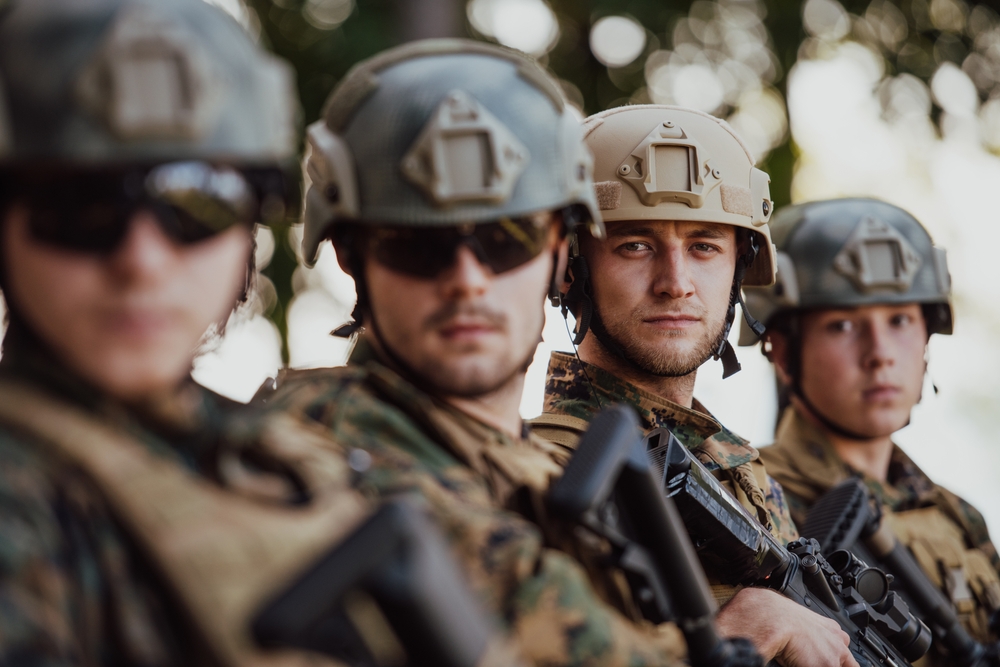 Soldier,Fighters,Standing,Together,With,Guns.,Group,Portrait,Of,Us